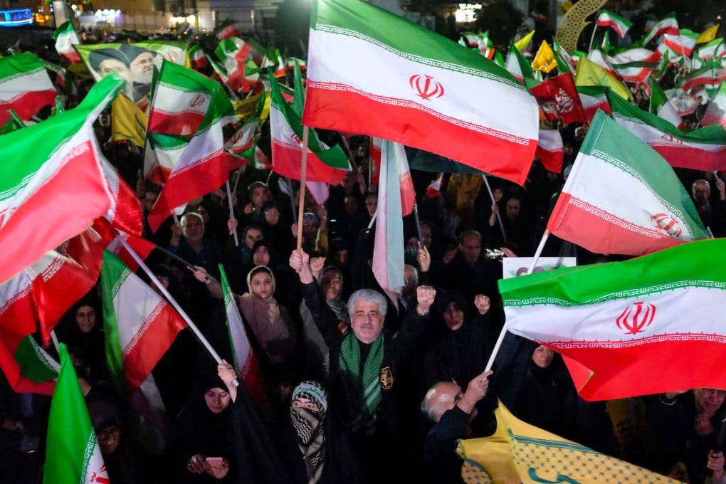 Pro-government demonstrators take to the streets of Tehran on Saturday. Photo: AP