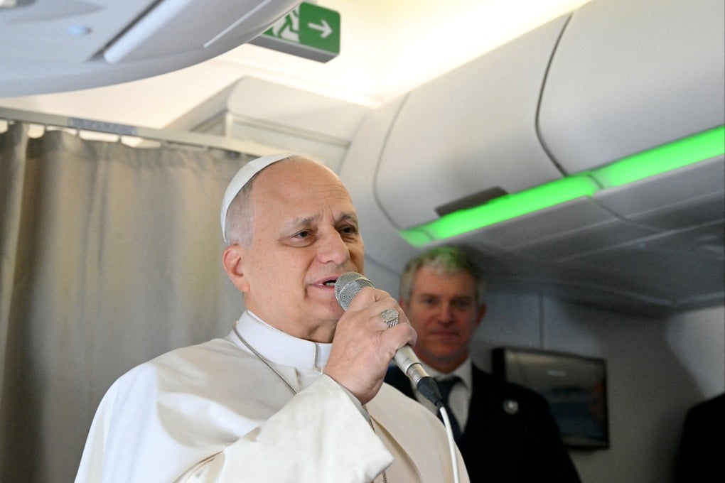 Pope Leo addresses journalists during a flight to Algiers on Monday. Photo: via Reuters