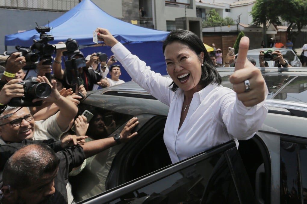 Keiko Fujimori departs a polling station after voting on Sunday. Photo: AP
