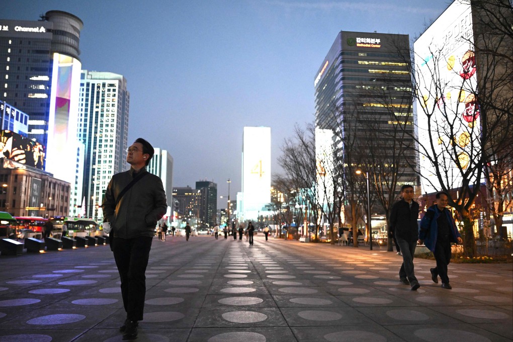 People walk through Gwanghwamun Square in Seoul, South Korea, earlier this month. Photo: AFP