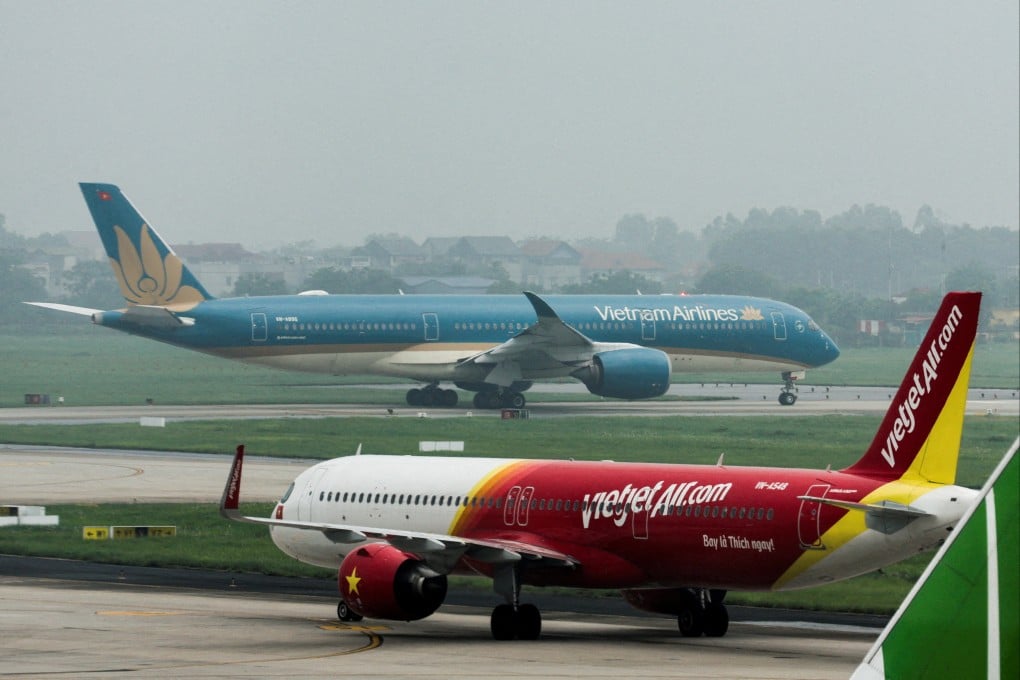 A Vietjet Airline airplane in front of a Vietnam Airlines airplane, at Noi Bai International Airport, in Hanoi, Vietnam, on May 28, 2025. Photo: Reuters
