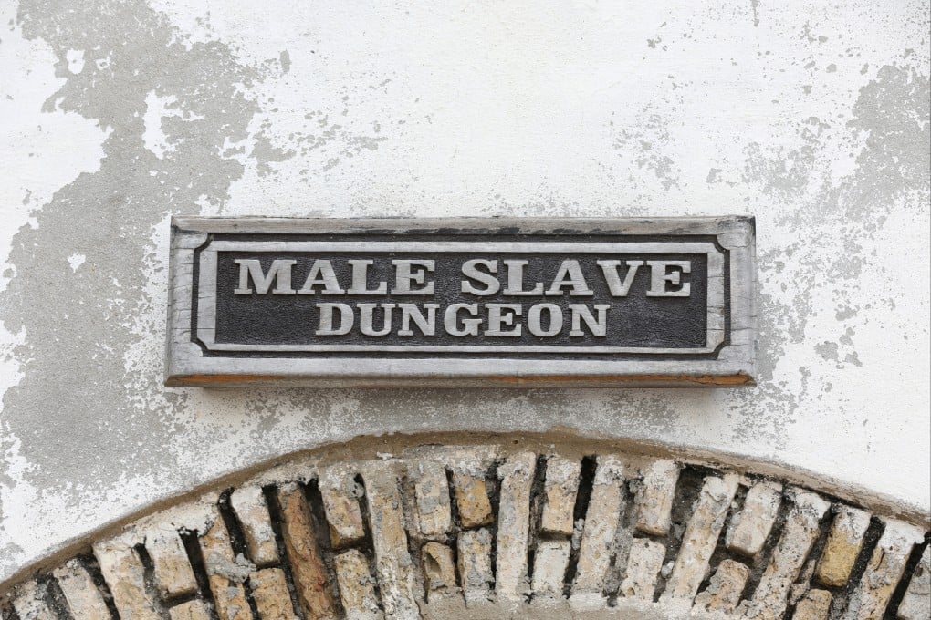 A sign hangs at the entrance of a dungeon used to house slaves at Elmina Castle in Ghana. The centuries-old site was a major centre of the transatlantic slave trade. File photo: Reuters