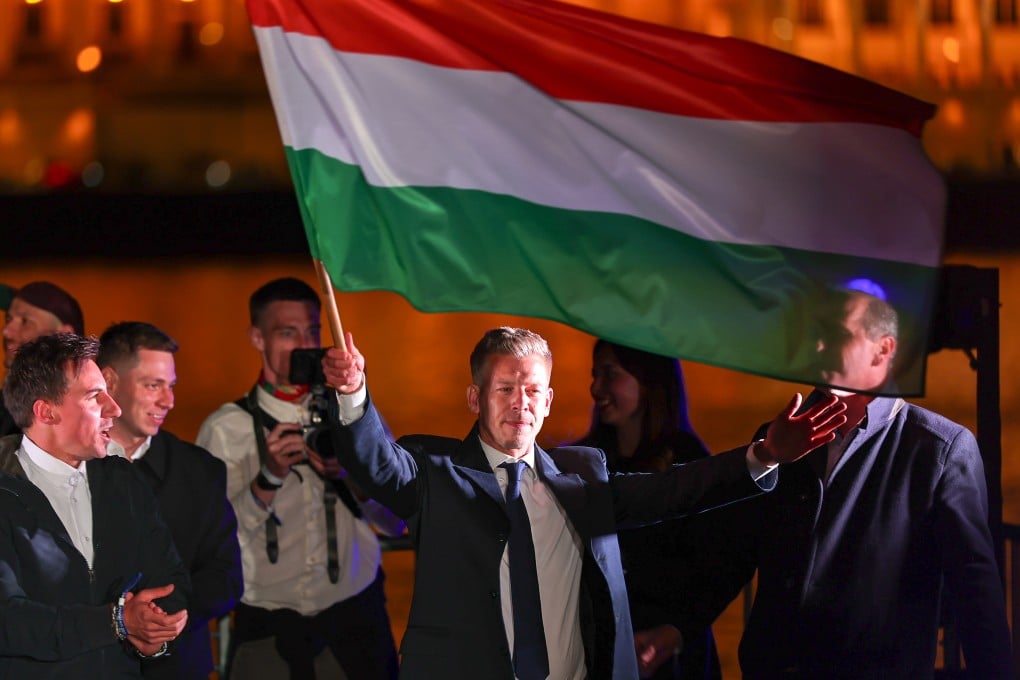 Peter Magyar, leader of Hungary’s Tisza Party, waves the national flag at a victory rally in Budapest on Sunday. Photo: Xinhua