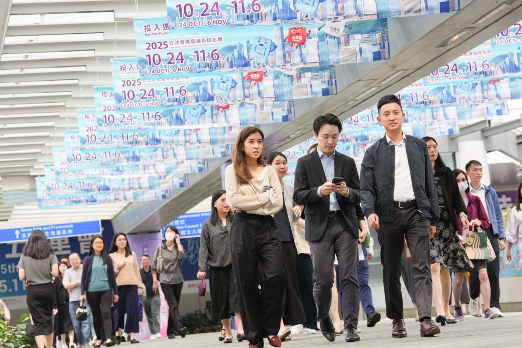 Civil servants leave the office in Tamar during lunch hour. Photo: Jelly Tse