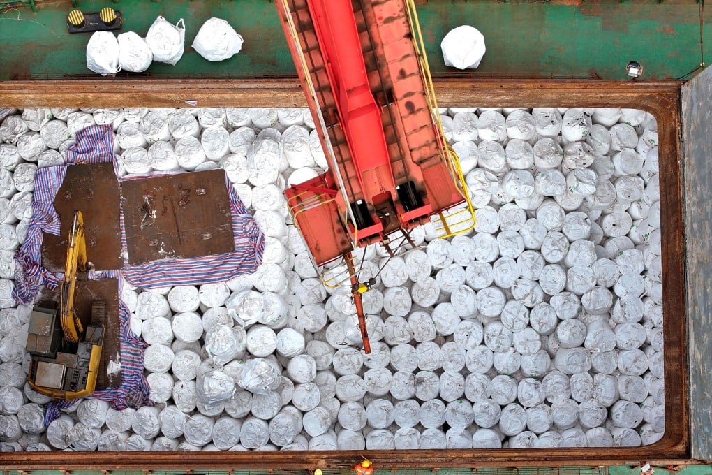 An aerial photo shows workers unloading imported fertilisers at the Lianyungang port, in eastern China’s Jiangsu province, on April 8. Photo: AFP