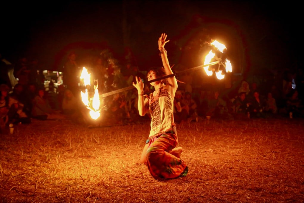 Zizi, a Chinese participant performing fire spinning at “Shambhala in Your Heart” festival. Photo: David Frazier