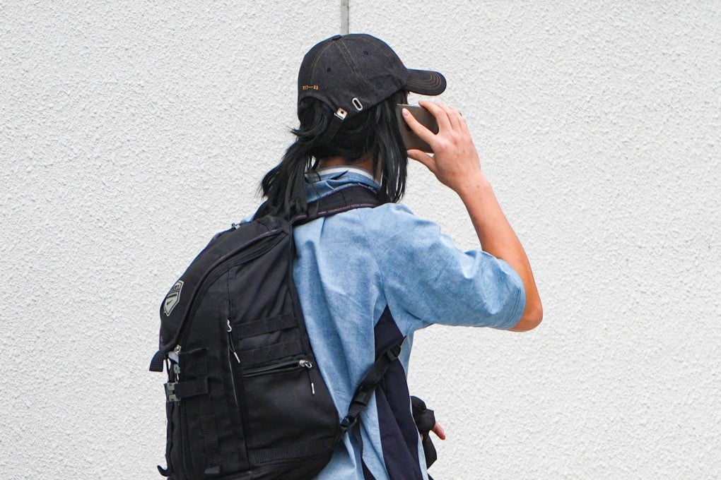 Xu Lina, 36, leaves Sha Tin Court after being cleared of forging her qualifications on a Top Talent Pass Scheme visa application. Photo: Eugene Lee