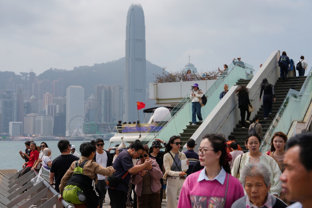 Visitors at the Victoria Harbour waterfront in Tsim Sha Tsui. Photo: Sam Tsang