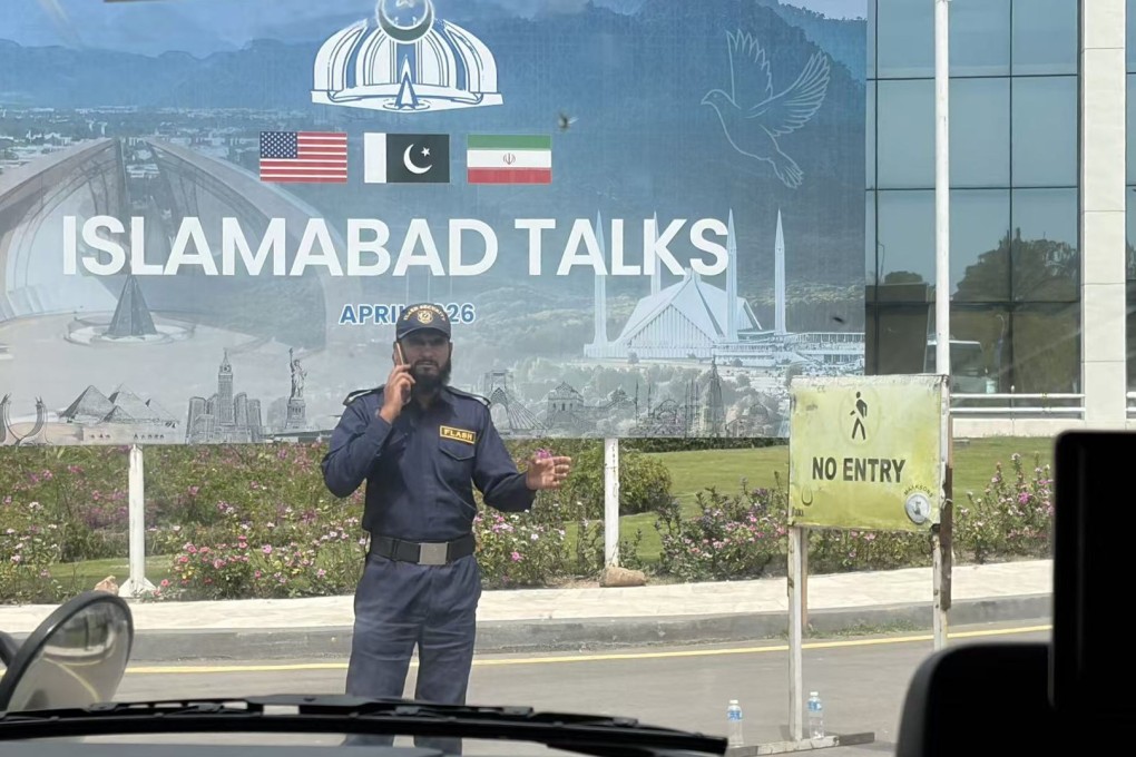A security guard stands in front of a billboard outside the Serena Hotel, the venue for the high-level US-Iran peace talks held over the weekend in Islamabad, Pakistan. Photo: Cici Cao