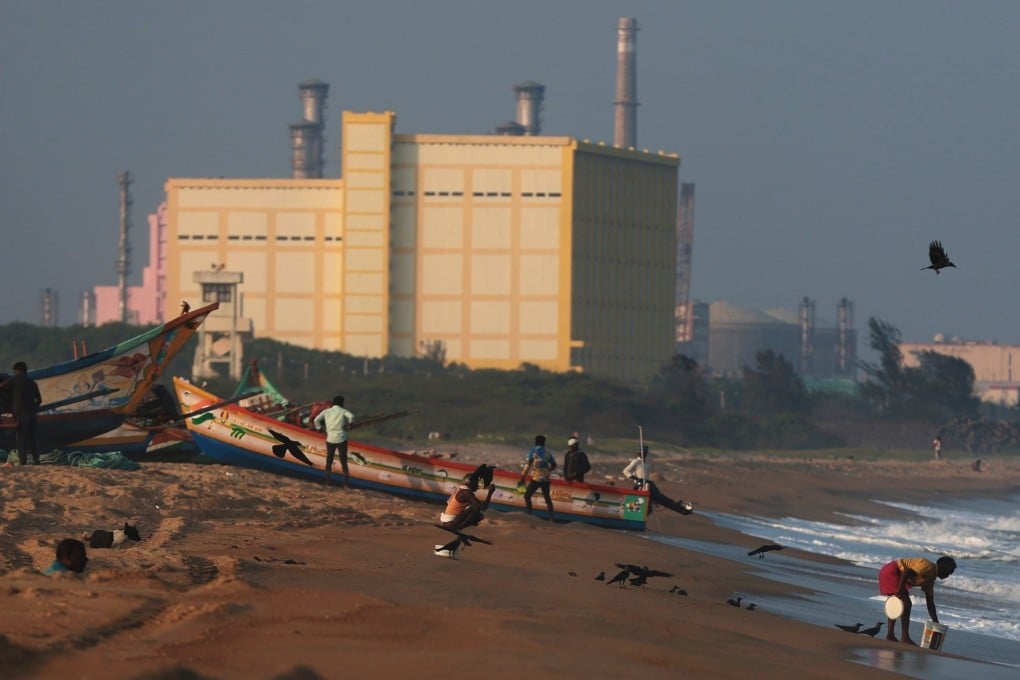 Fishermen pull their boats to the shore near the Kalpakkam atomic power station in Tamil Nadu. Photo: AP