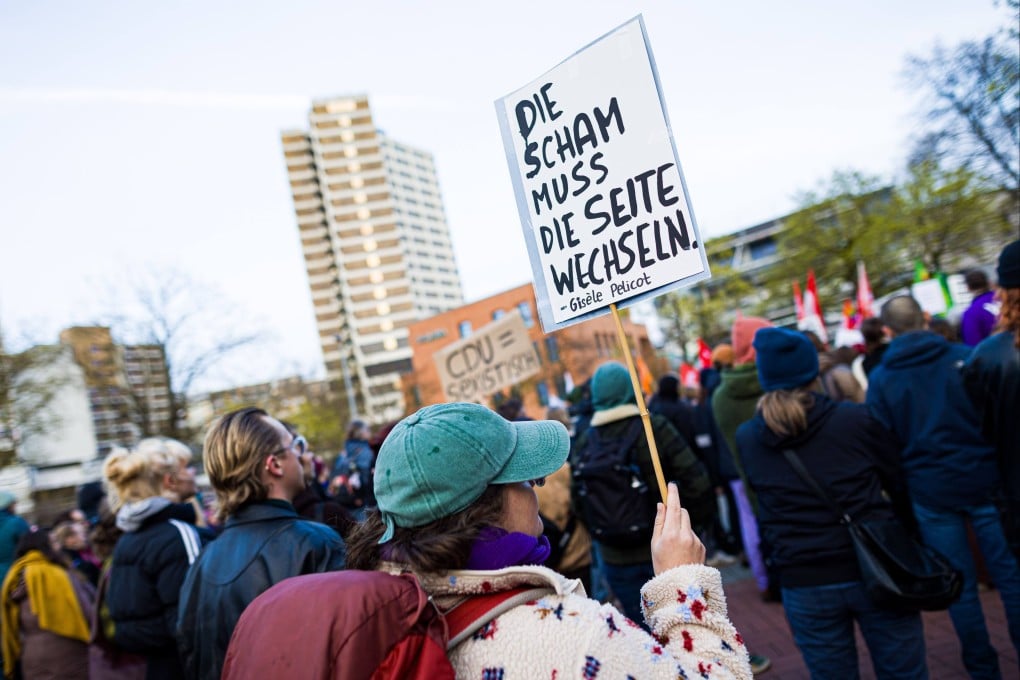 A protester at a March rally against sexual violence in Hanover, Germany, holds a sign with the Gisele Pelicot quote ‘shame must change sides’. Photo: dpa
