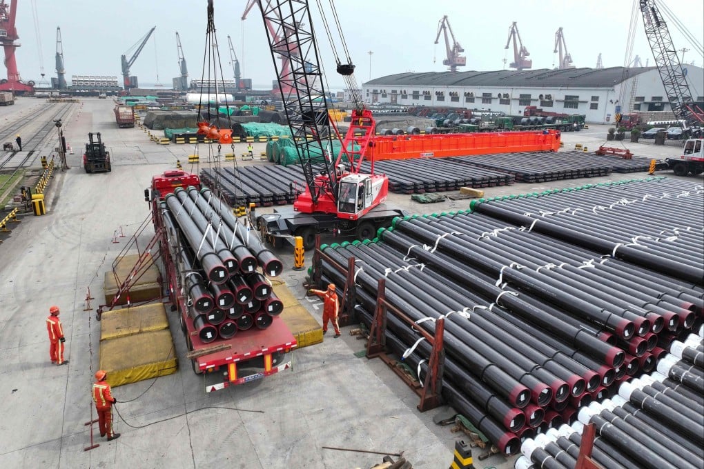 Workers prepare steel pipes for shipment at Lianyungang Port, in Jiangsu province, on Saturday. Photo: AFP
