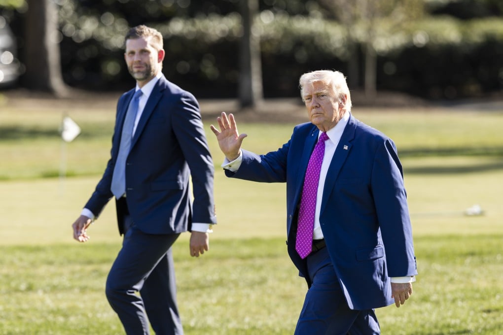 US President Donald Trump (right) and his son Eric Trump leave the White House in Washington on Friday. Photo: EPA