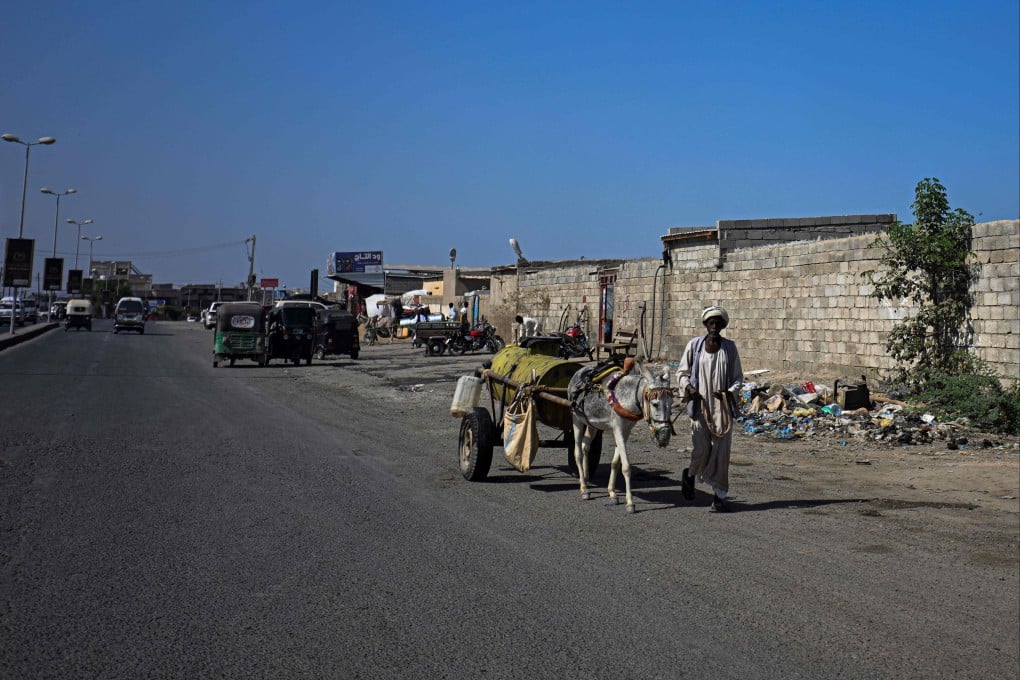 A Sudanese man pulls a donkey cart filled with water for sale in Port Sudan on Tuesday. Photo: AFP