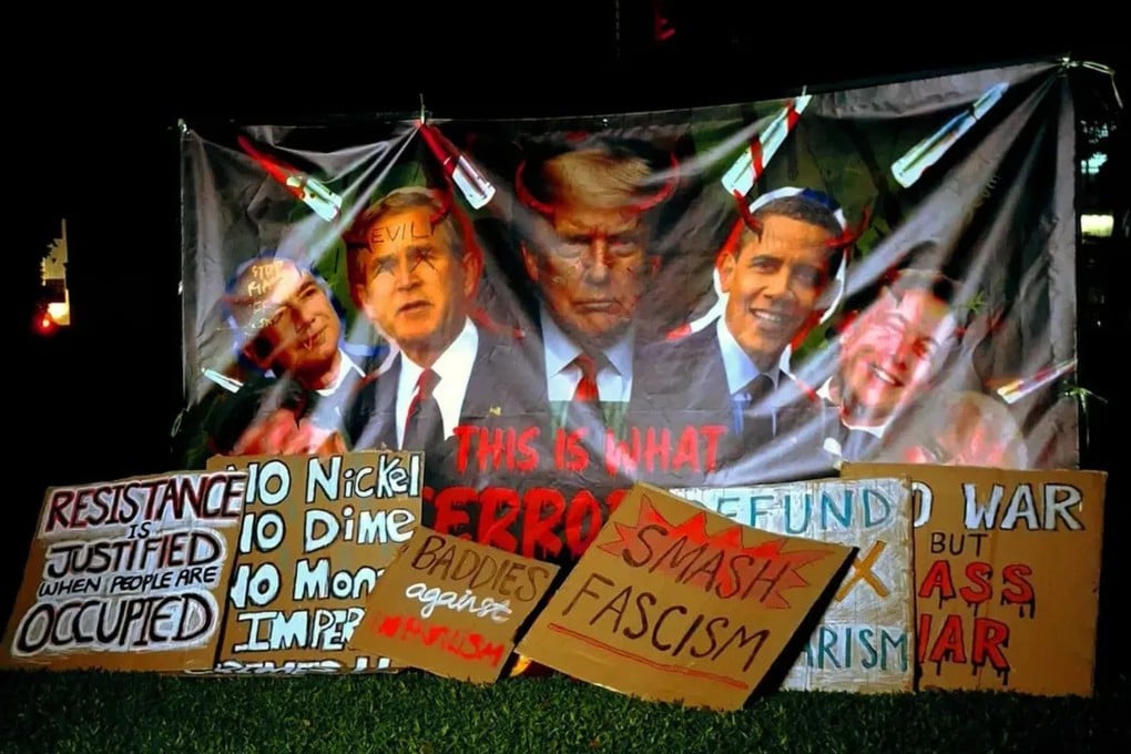 A banner at a protest in Singapore’s Hong Lim Park on Saturday shows past and present US presidents with horns on their heads. Photo: Instagram/sgacadboycott