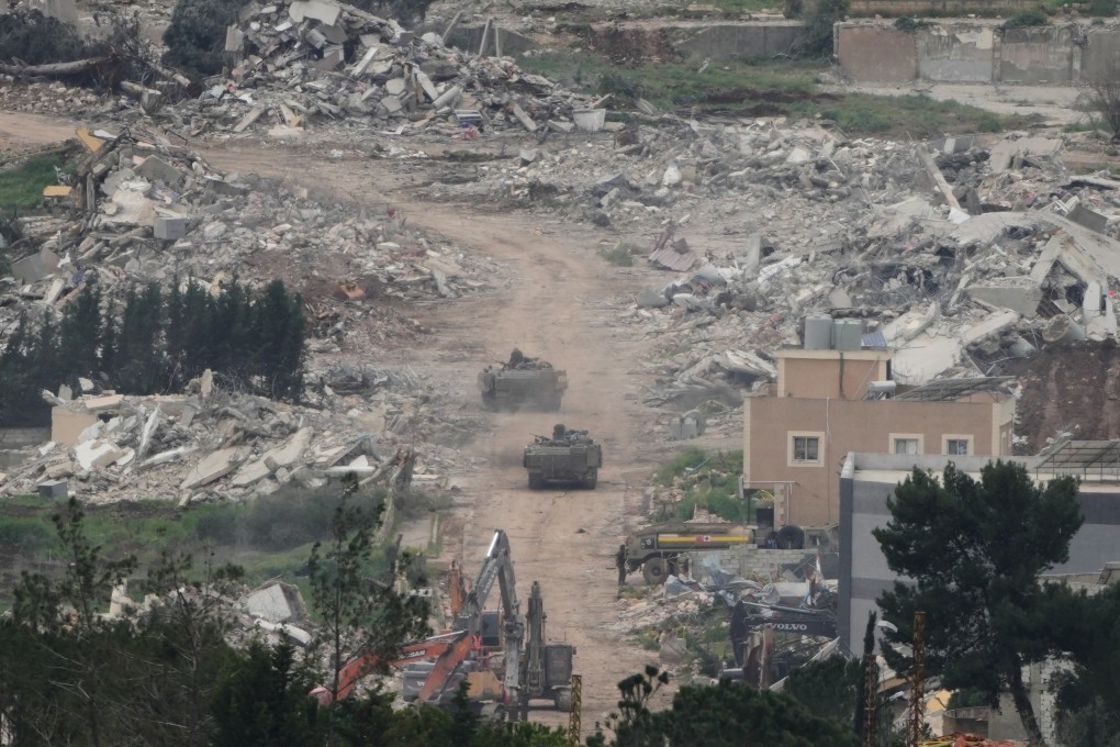 Israeli army vehicles and bulldozers operate in southern Lebanon, as seen from northern Israel, on Wednesday. Photo: AP