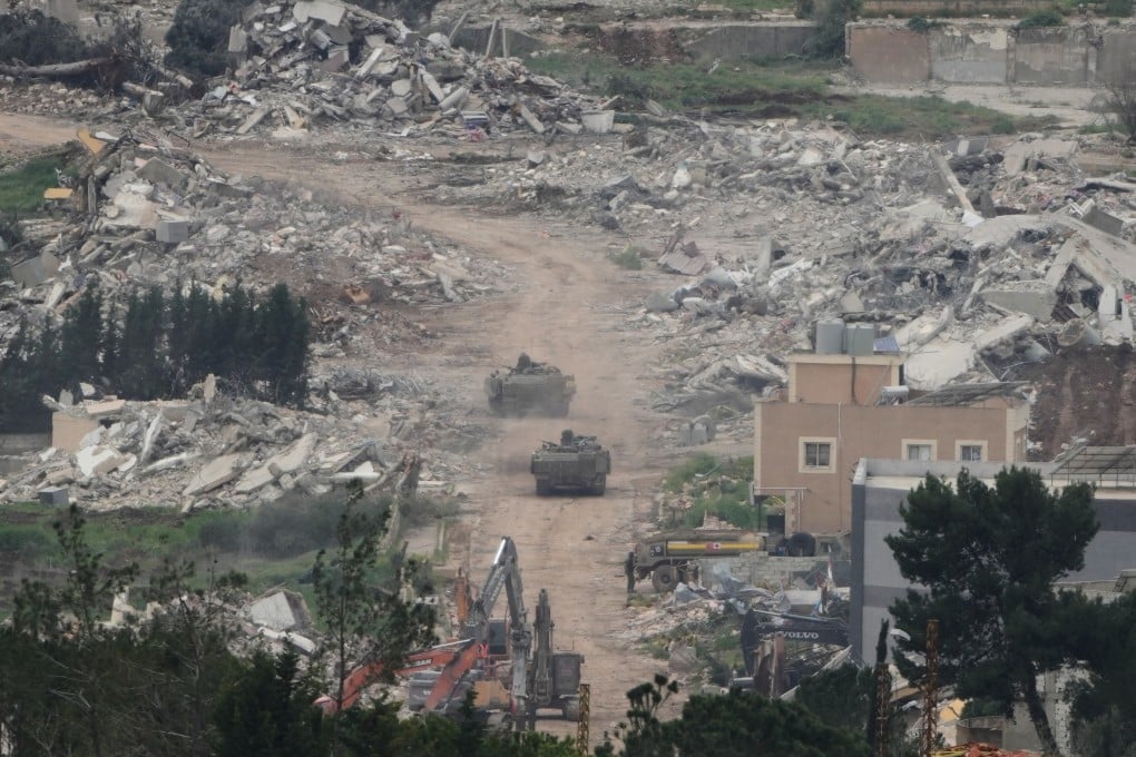 Israeli army vehicles and bulldozers operate in southern Lebanon, as seen from northern Israel, on Wednesday. Photo: AP