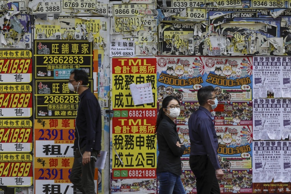 People walk past a closed shop in Causeway Bay on March 16, 2020. Photo: Sam Tsang