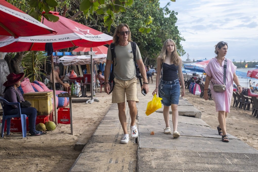 Tourists walk at a shopping area in Kuta, Bali, Indonesia. Photo: EPA