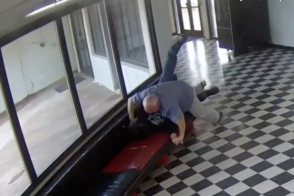 Principal Kirk Moore can be seen struggling with Victor Hawkins, a former student who allegedly carried a firearm onto the campus in Pauls Valley, Oklahoma, on April 7. Photo: Pauls Valley Public Schools via AP