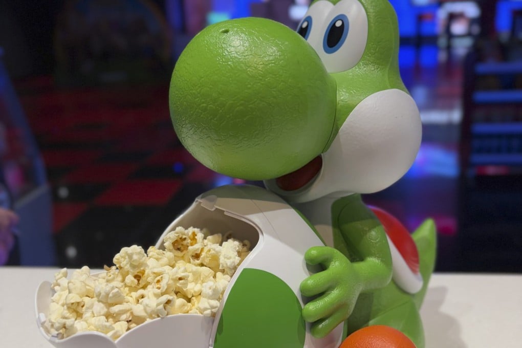 A Yoshi popcorn bucket is seen at Cineworld Wandsworth in London, England. Cinema operators are betting on increasingly elaborate popcorn buckets to capitalise on millennial nostalgia, drum up excitement for films and ultimately increase profits. Photo: courtesy of Cineworld Wandsworth