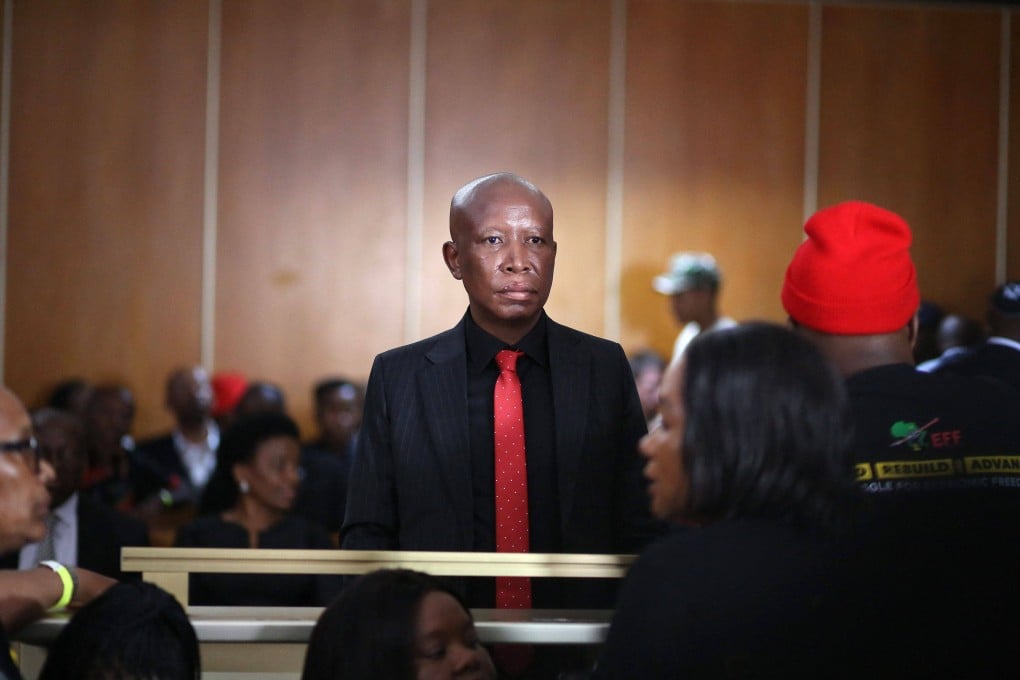 Julius Malema stands in the dock for sentencing over firing an assault rifle at a rally eight years ago. Photo: AFP