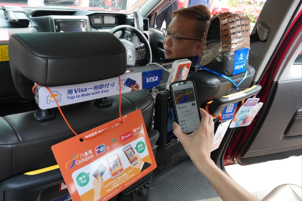 Various electronic payment systems are offered in a taxi, in compliance with a law that came into effect on April 1. Photo: Jelly Tse
