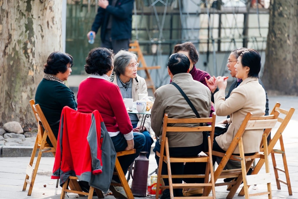 A group of older Chinese people gather at Shanghai’s Fuxing Park. The city is now encouraging seniors to return to work. Photo: Shutterstock