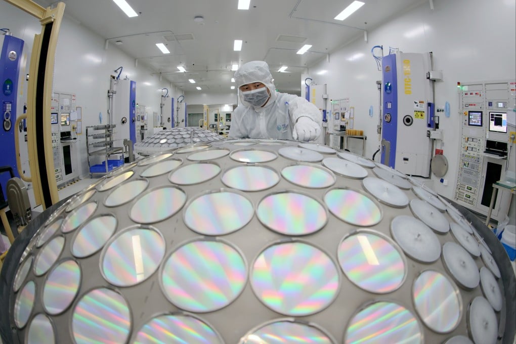 A worker produces LED chips on a production line in China’s Jiangsu province. Photo: Getty Images