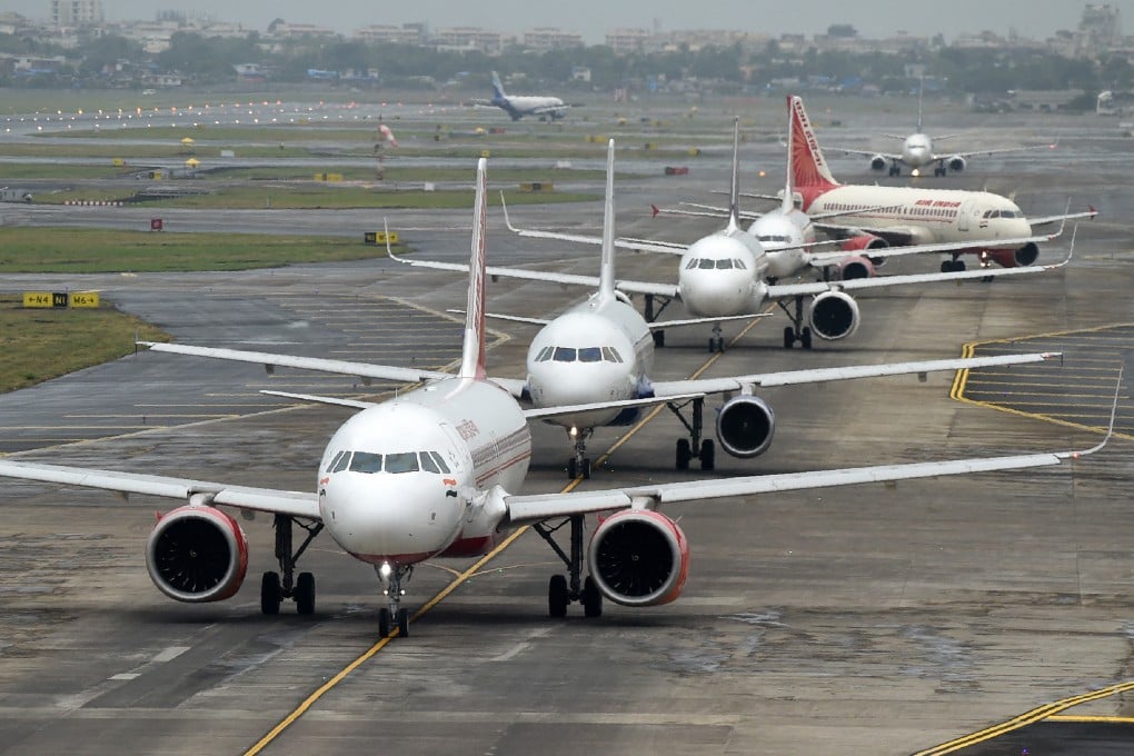 Aircraft queue up on the tarmac before taking off at Mumbai airport. Photo: AFP