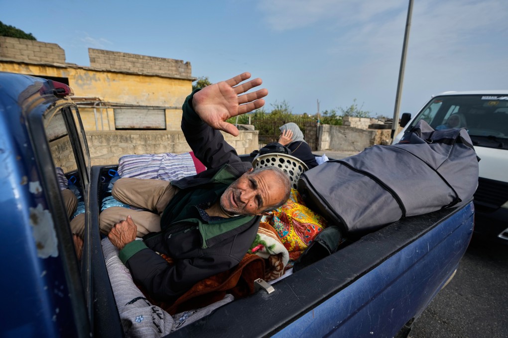 A man returns with his family to their village amid a ceasefire between Hezbollah and Israel. Photo: AP