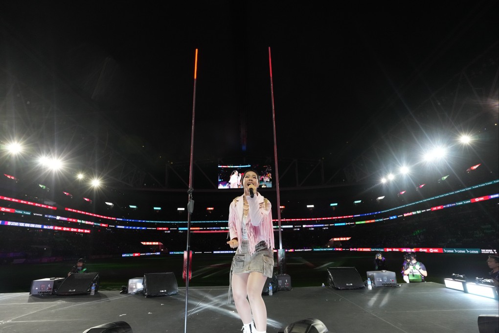 Singer Gwyn Dorado performs in front of the South Stand as part of the opening ceremony for the Cathay/HSBC Hong Kong Sevens. Photo: Elson Li