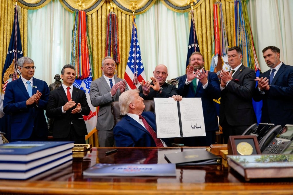 Trump holds an executive order about easing restrictions on mental health treatments, including ibogaine, which he signed. Photo: Reuters