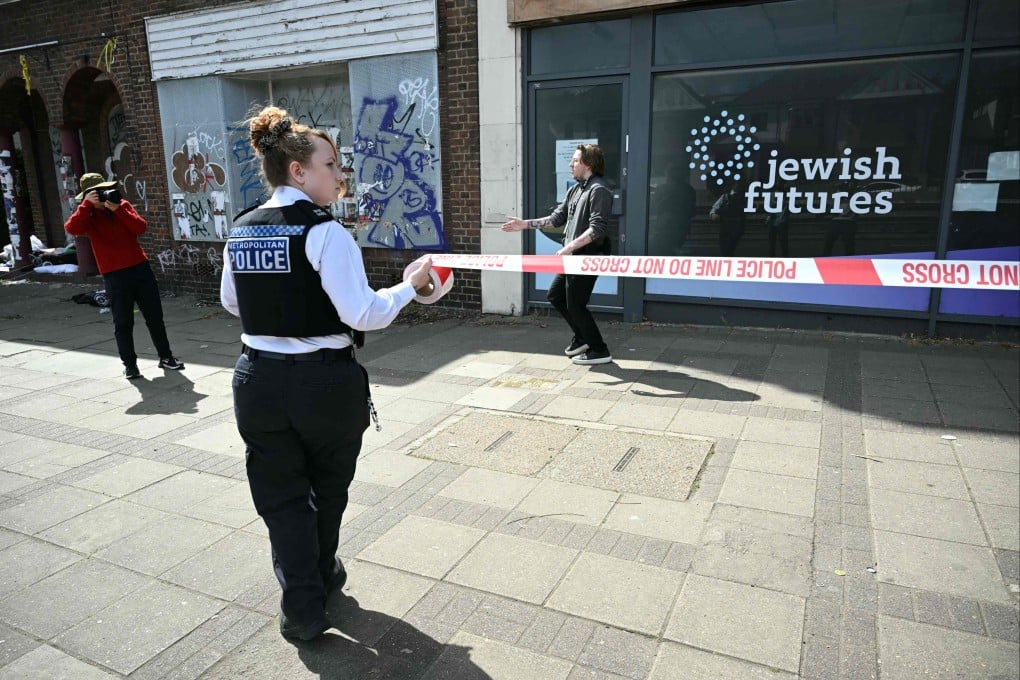 Police on Saturday cordon off the area outside of the business following an arson attack in Hendon, north London. Photo: AFP