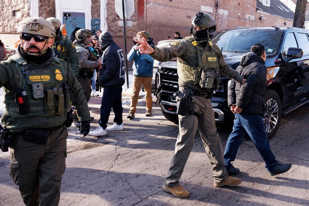ICE agents detain a man in the Little Village neighbourhood of Chicago on December 16, 2025. Photo: Chicago Sun-Times/AP