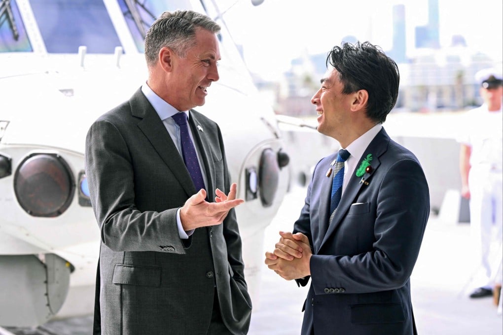 Australia’s Deputy Prime Minister and Minister for Defence Richard Marles (left) and Japan’s Minister of Defence Koizumi Shinjiro chat after signing the contract for Japan to deliver the first three of Mogami-class warships, in Melbourne on April 18, 2026. Photo: AFP