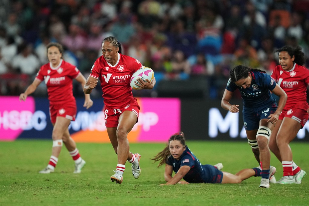 Charity Williams (with ball) scored tow tries as Canada knocked out arch-rivals USA on Saturday. Photo: Sam Tsang