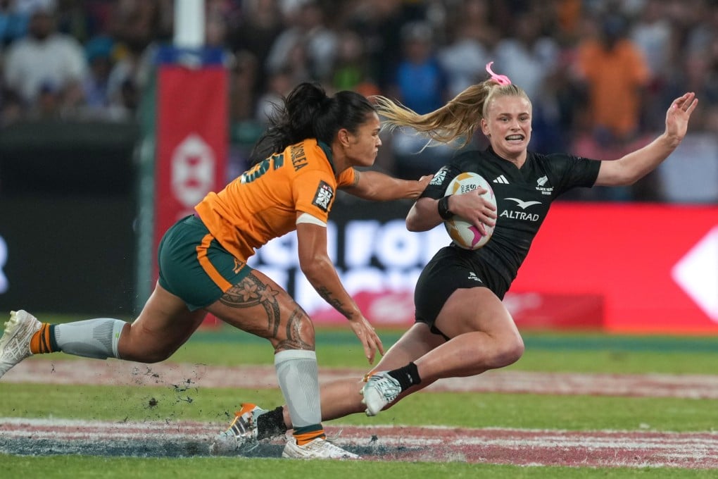 New Zealand’s Jorja Miller (right) evades the tackle of Australia’s Alysia Lefau-Fakaosilea in the Cathay/HSBC Hong Kong Sevens cup final at Kai Tak Stadium on Sunday. Photo: Sam Tsang