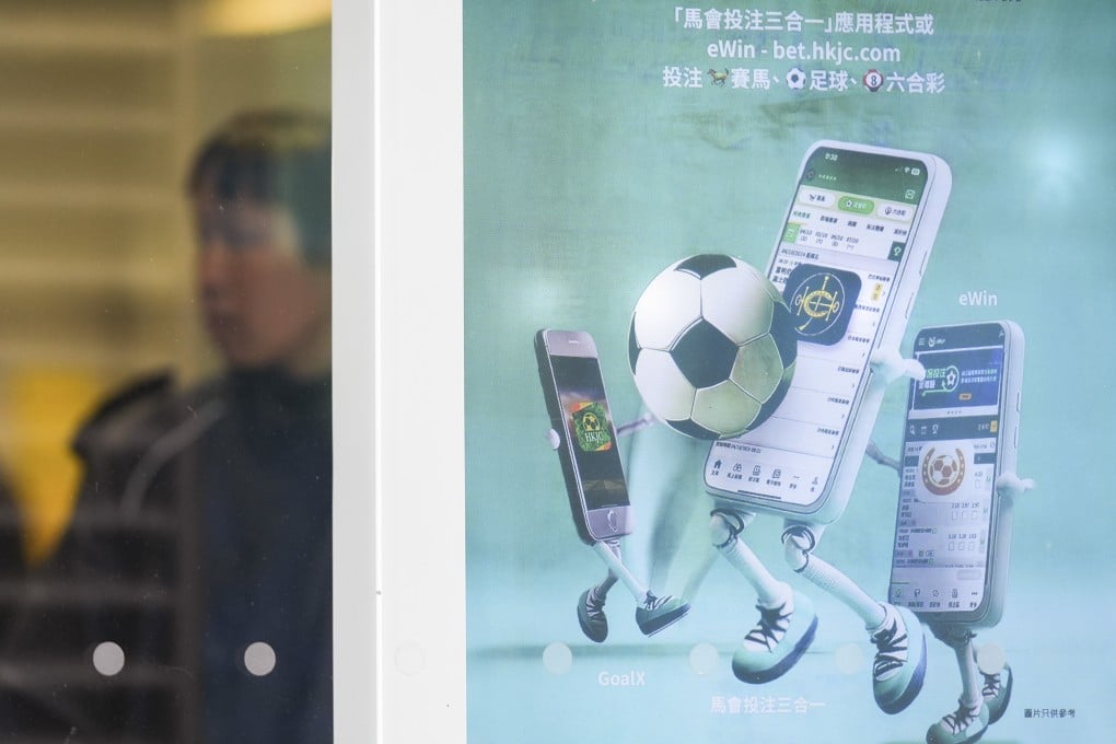 An advertisement for the Hong Kong Jockey Club’s eWin app at a betting branch in Sheung Wan on February 26. Photo: Eugene Lee