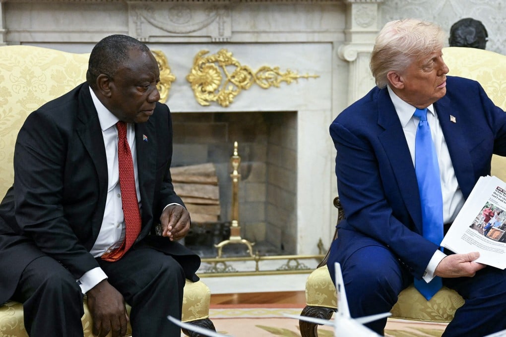 President Donald Trump shows pictures during a meeting with South African President Cyril Ramaphosa in the Oval Office of the White House in Washington, US, on May 21 last year. Photo: TNS
