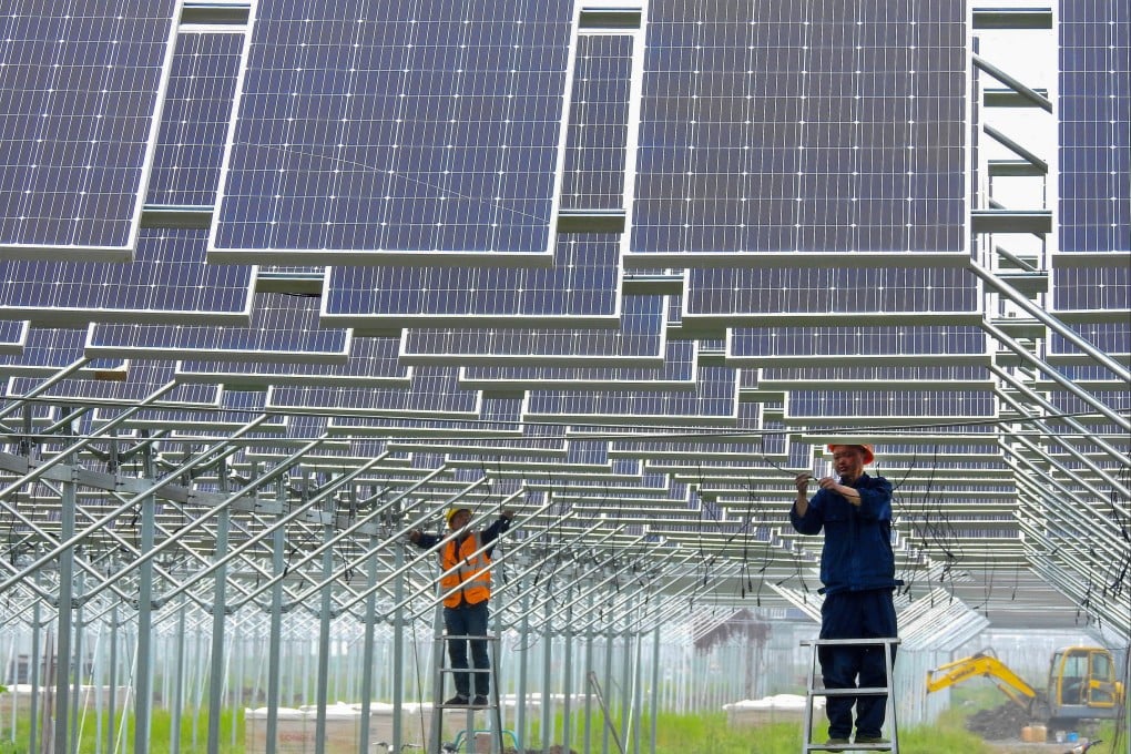 Workers install solar panels in China’s eastern Jiangsu province. Photo: Reuters