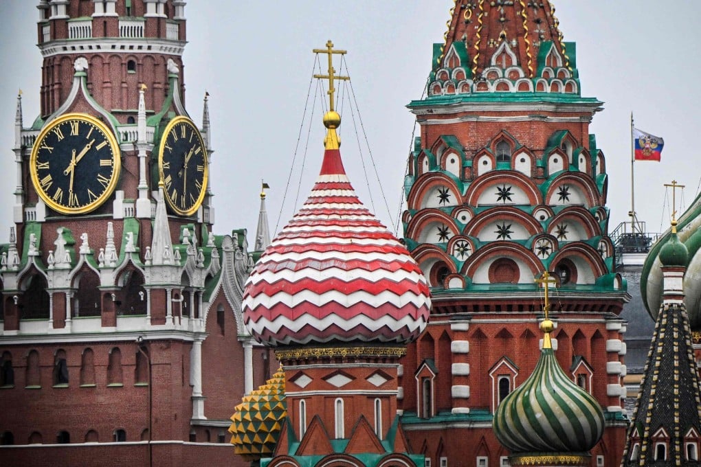 The Kremlin’s Spasskaya tower and St. Basil’s cathedral in downtown Moscow. Russia says it has arrested a German woman over a planned “terrorist attack” linked to Ukraine. Photo: AFP