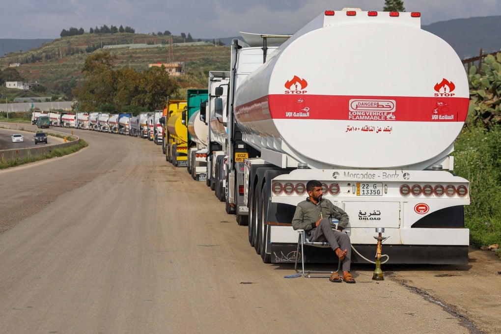 Iraqi oil tankers queue up along the Tartus-Latakia Highway on Sunday as Iraq exports oil through Syria as a result of the closure of the Strait of Hormuz. Photo: DPA