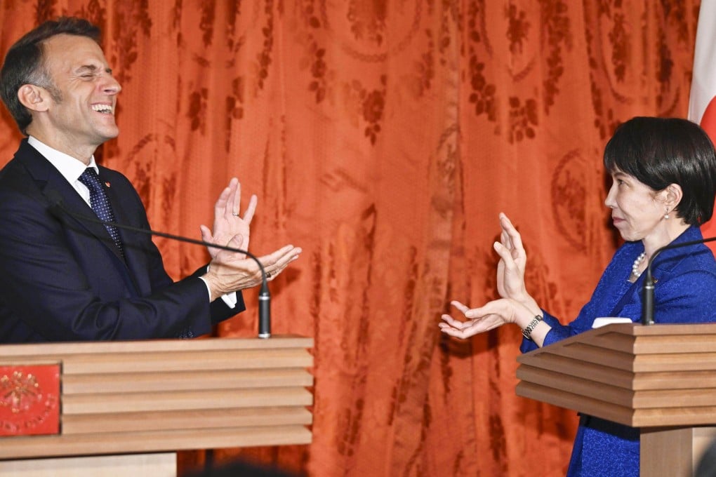 Japanese Prime Minister Sanae Takaichi (right) and French President Emmanuel Macron strike the “Kamehameha” pose from the “Dragon Ball” manga after a joint press conference at the State Guest House in Tokyo on April 1. Photo: Kyodo