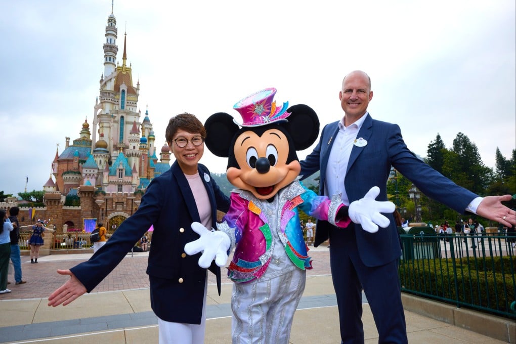 Sam Chan (left), director of marketing, and Tim Sypko, managing director, join Mickey Mouse at Hong Kong Disneyland Resort which is planning expansion projects including Pixar- and Marvel-themed experiences.