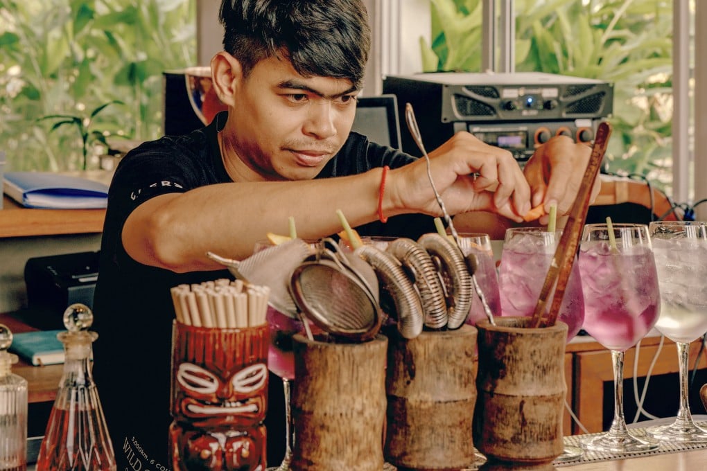 A bartender puts the finishing touches on cocktails served at Seekers Spirits’ distillery and bar in Phnom Penh, Cambodia. Photo: Seekers Spirits