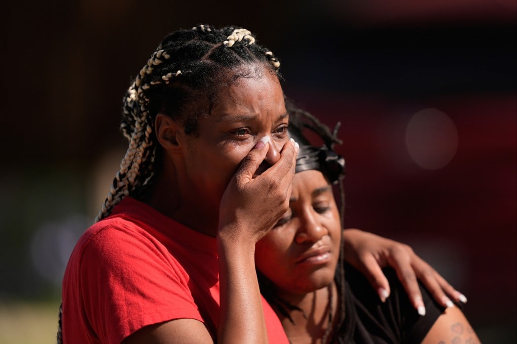 People grieve near the scene of the mass shooting in Shreveport, Louisiana. Photo: AP