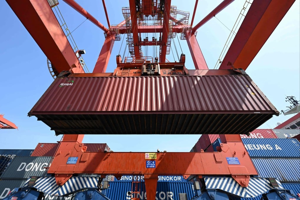 A crane loads cargo onto a ship at a port in Zhangjiagang, in China’s eastern Jiangsu province. Photo: AFP