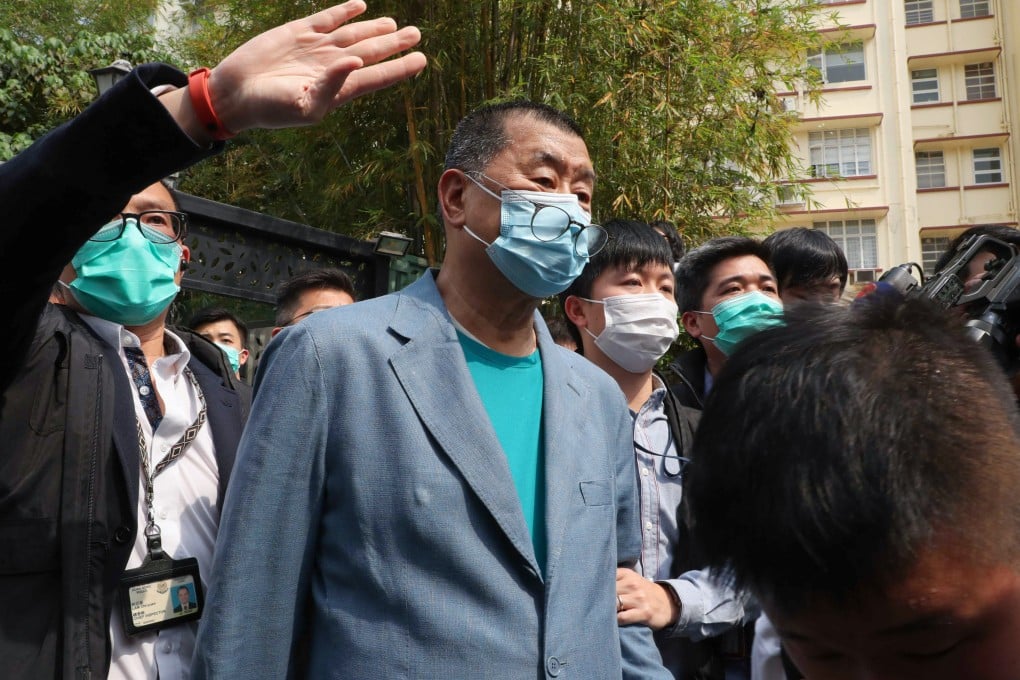 Police officers arrest Jimmy Lai at his home back in 2020. Photo: Edmond So
