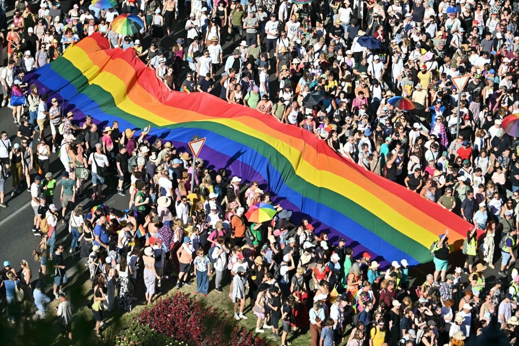 People carry a Rainbow flag at the Budapest Pride parade held in Hungary’s capital last year. Photo: AFP